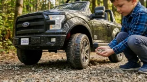 A photorealistic 4K image set on a rugged Canadian forest trail, featuring a close-up of a child's hand next to the highly detailed, treaded all-terrain tire of a black 12V toy Ford F-150-style truck with a 'CANADA' license plate. Weathered decals like 'ALL-TERRAIN PRO' and a bilingual '4x4 RIDE-ON / JOUET 4x4' are visible, emphasizing durability.
