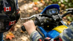 Close-up photorealistic illustration highlighting the deep, knobby all-terrain rubber tire tread on a 12v electric motorcycle for kids, suitable for rugged Canadian park paths.