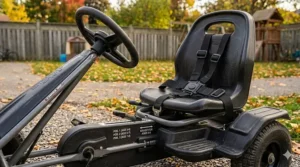 Close-up of safety features on an adjustable ride-on toy for children of various ages.