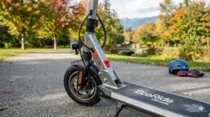 A close-up view of the front wheel, disc brake, and lighting assembly of a high-detail electric scooter on an outdoor path.