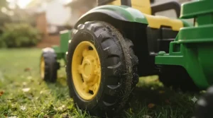 Chunky traction tires on the 6v tractor for smooth travel over grass and dirt.