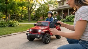 Child smiling inside a playroom while steering a pink kids electric jeep with remote control during Canadian winters.