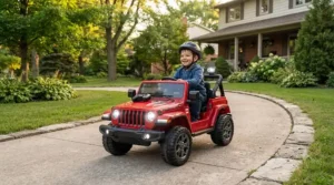Parent using a 2.4G parental remote control to steer a black kids electric jeep safely on a sidewalk.