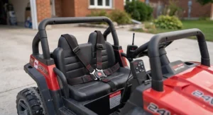 Close-up of safety seat belts and remote control features on a 24v kids UTV for peace of mind.