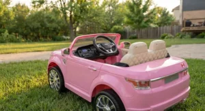 Pink 2 seater electric ride on kids toy car with MP3 sound system and comfortable leather seats