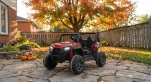 A durable 24v kids UTV parked outside during autumn, ready for outdoor fun.