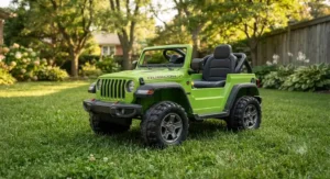 Green Jeep Rubicon push ride-on toys with rugged wheels parked on a lawn